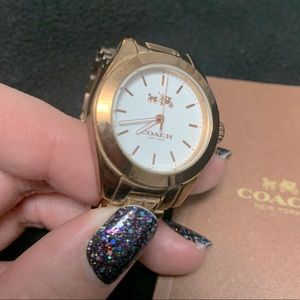 Rose gold women’s COACH watch